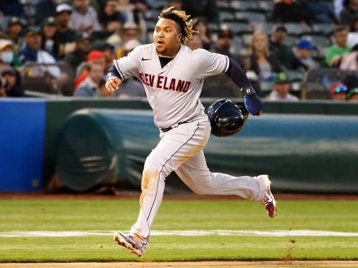 Jul 16, 2021; Oakland, California, USA; Cleveland Indians third baseman Jose Ramirez (11) runs home to score a run against the Oakland Athletics during the sixth inning at RingCentral Coliseum.